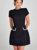  "Black shiny elegant mini dress with radiant allure for parties"